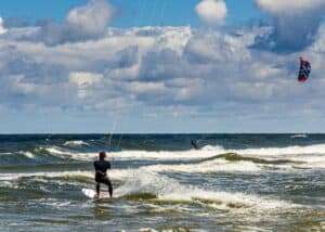 person surfing on sea waves during daytime